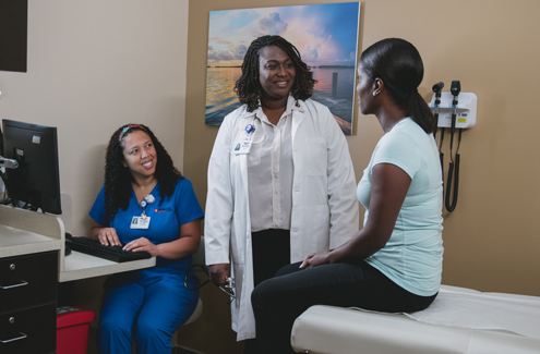 Patient at a consultation with their primary care provider and assistant